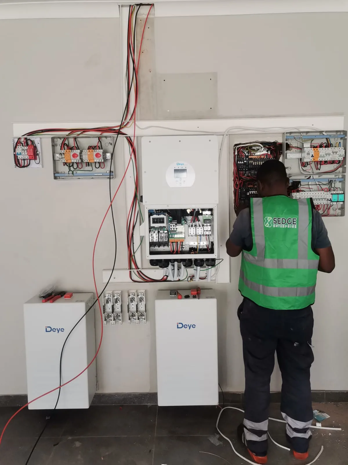 SEDGE technician working on an energy system